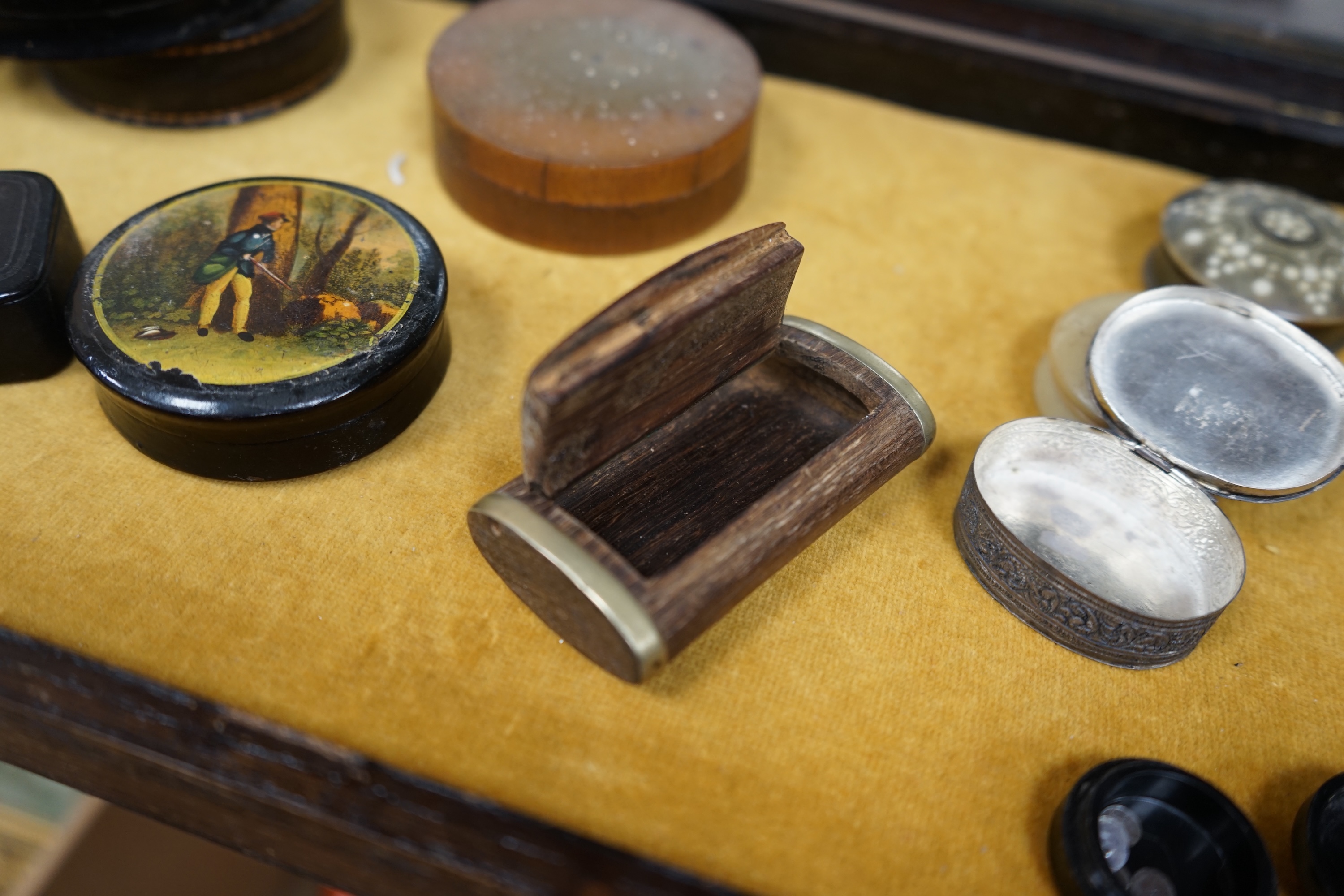 Ten various snuff boxes to include horn, white metal, brass mounted and one printed with a classical scene, 19th/20th century, largest 9cm in diameter. Condition - fair